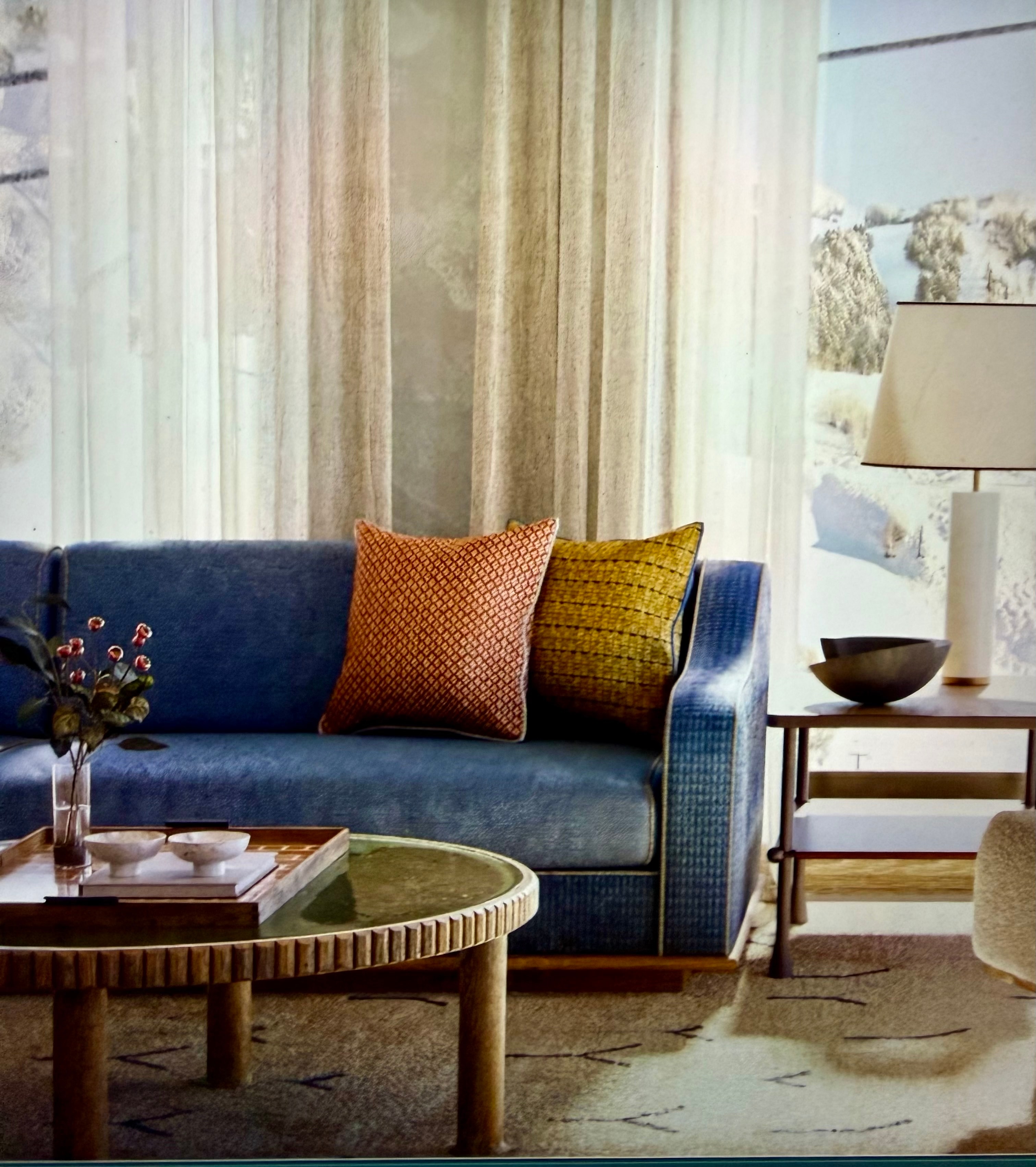 Chalet Alpina Mountain Home interior concept rendering with blue sofa, furnishings, windows, and mountain view