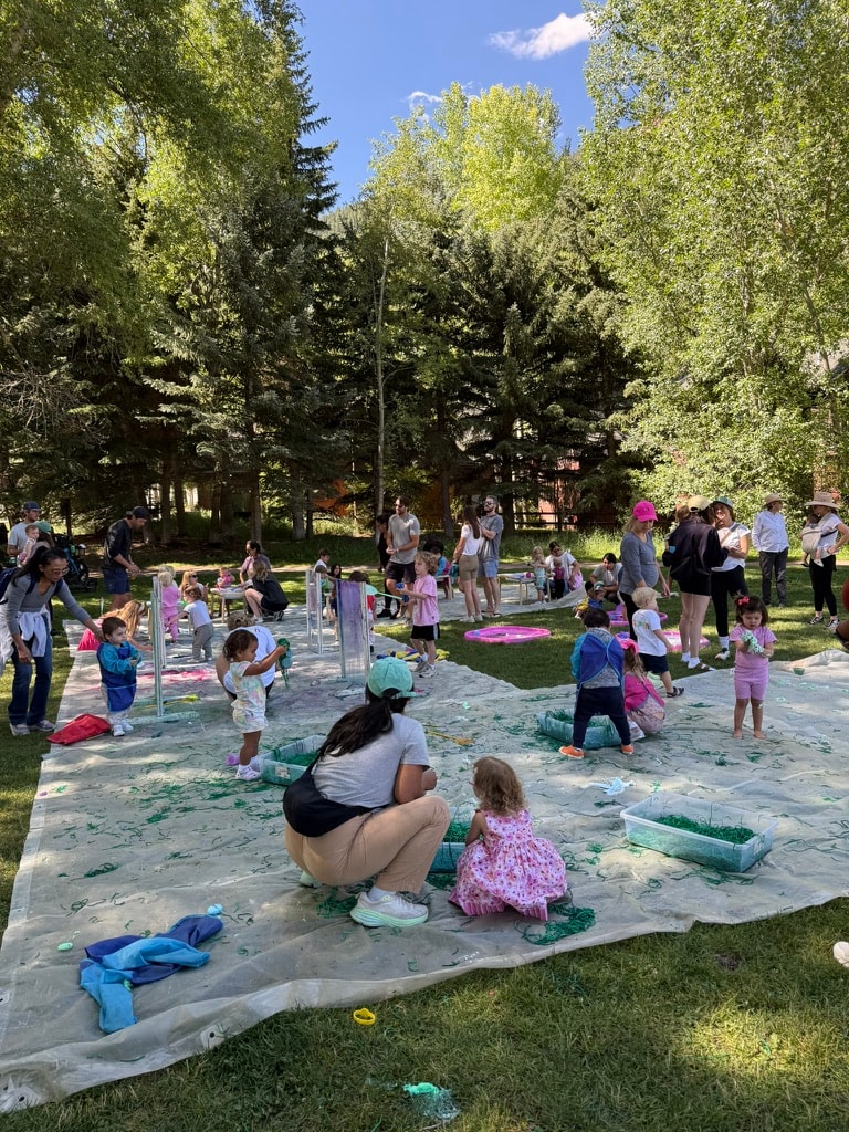 Children and families participating in an outdoor summer art activity in Aspen
