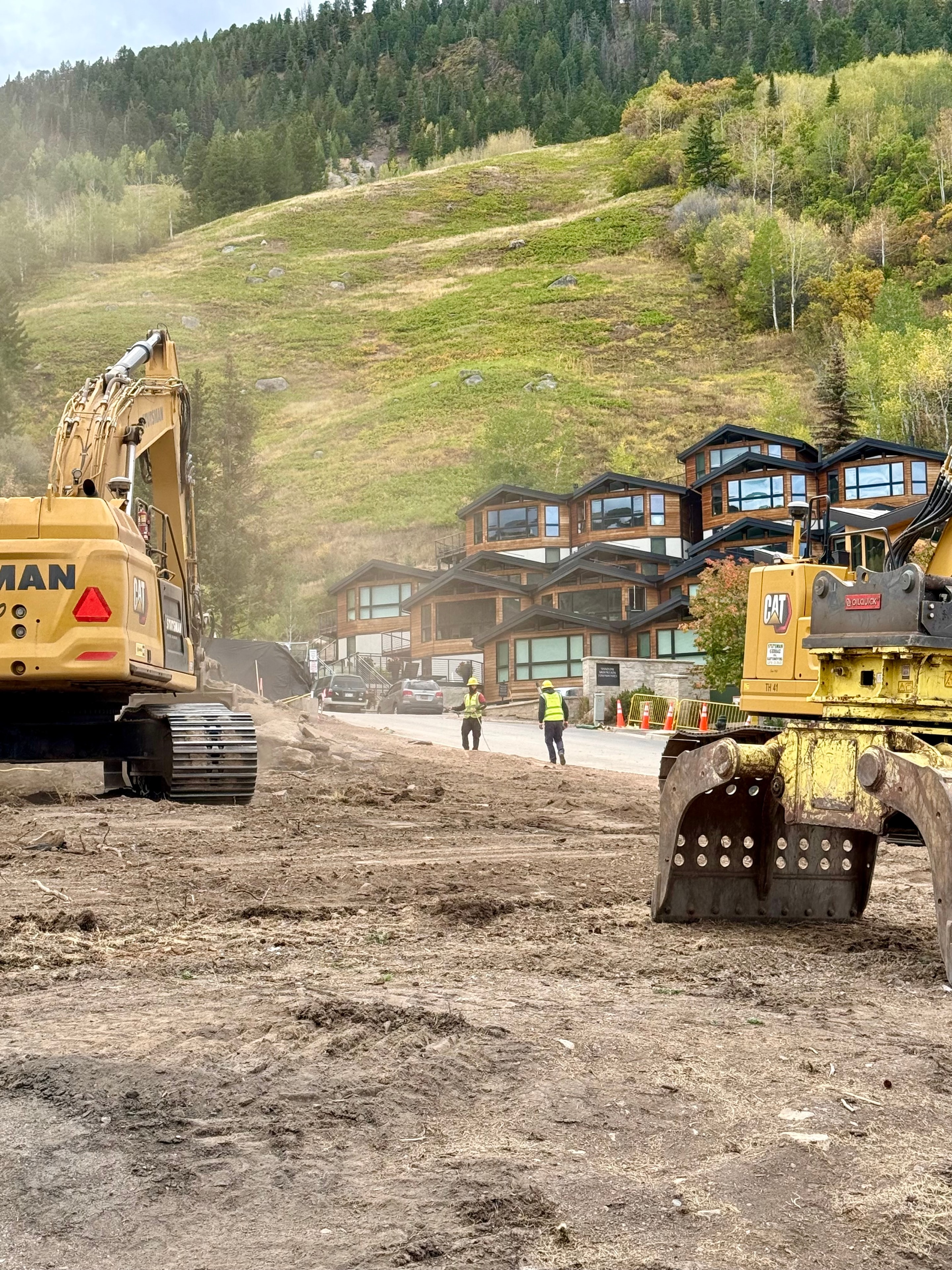 Two yellow CAT excavators and construction workers at the Lift One and Chalet Alpina site in Aspen on September 8, 2026